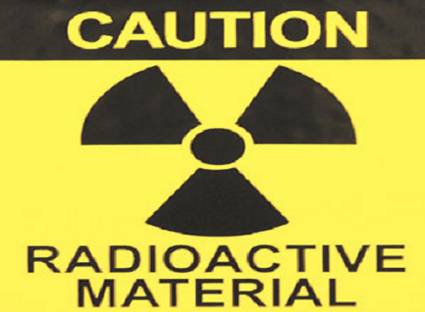 Cartello: Attenzione - Materiale Radioattivo.